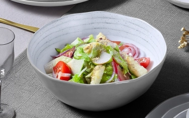Salad bowl with salad spoon fork